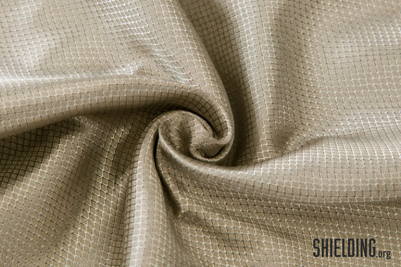 Close-up of 100% silver yarn woven fabric with 'SHIELDING.org' logo in the corner.