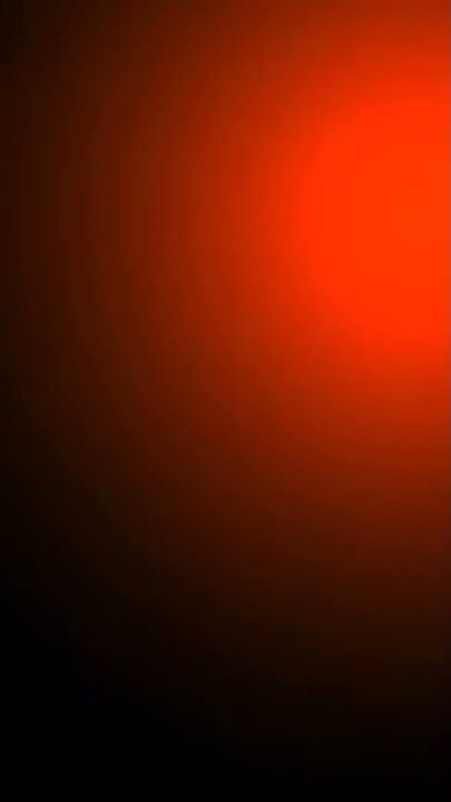 A red glow coming from the right upper corner into the dark