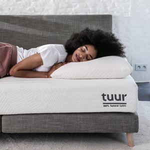 Woman sleeping on the 100% Natural Latex Tuur® Pillow.